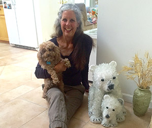 Jennifer with her dog Kiwi and Tammura Polar Bears sculpture