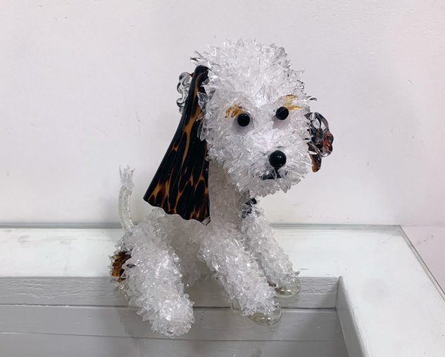 Chaz White, black, and brown spotted dog glass sculpture